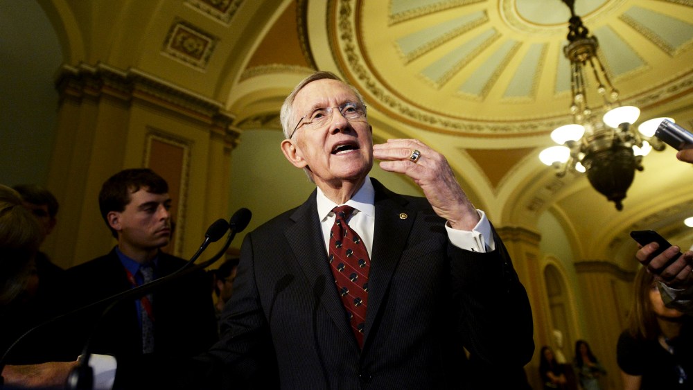 Harry Reid, responds to questions from the news media following a Democratic policy luncheon, April 29, 2014.