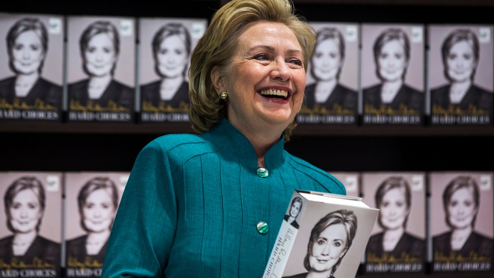 Hillary Clinton prepares to sign copies of her new memoir 'Hard Choices' at a Costco store in Arlington, Va, June 14, 2014.