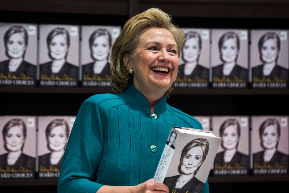 Hillary Clinton prepares to sign copies of her new memoir 'Hard Choices' at a Costco store in Arlington, Va, June 14, 2014.