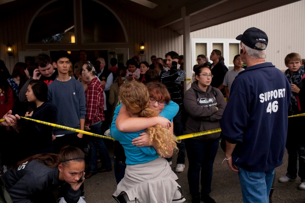 Students gather with parents and at Shoults Gospel Hall in Marysville, Wash. on Oct. 24, 2014, after a school shooting that occured at the Marysville-Pilchuck High School nearby.
