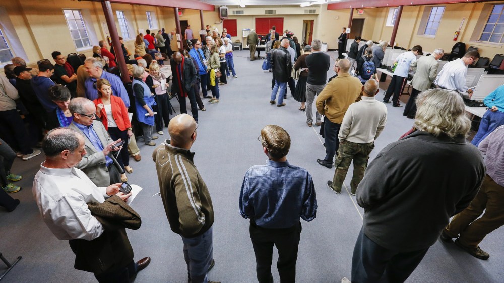Voters wait in a long line to cast their ballots at Epworth United Methodist Church during the midterm Election Day in Atlanta, Ga. on Nov. 4, 2014.