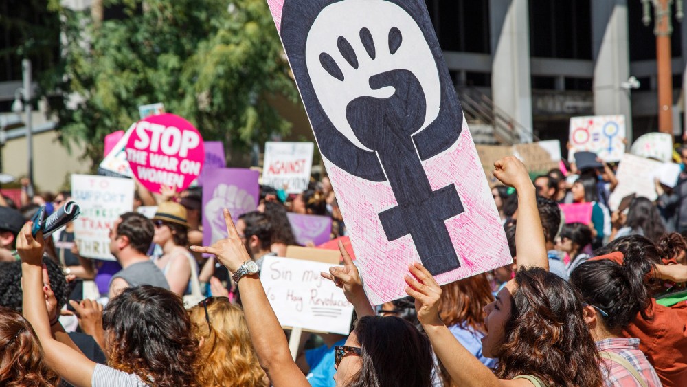 Protesters attend a march for equal rights and justice to mark International Women's Day, in downtown Los Angeles, Calif. on March 8, 2015. (Photo by Eugene Garcia/EPA)
