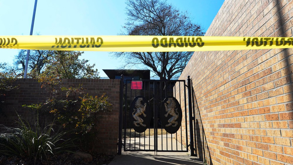 A view of the locked gates at the closed and abandoned Sigma Alpha Epsilon, SAE fraternity house on the campus of Oklahoma University in Norman, Okla., on March 11, 2015. (Photo by Larry W. Smith/EPA)