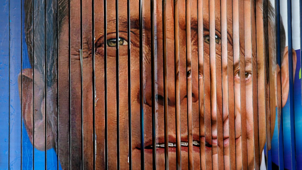 A rotating billboard that shows the faces of the two candidates for Israel's prime minister, incumbent Benjamin Netanyahu (R) and opposition leader Yitzhak Herzog, in Tel Aviv, Israel on March 12, 2015.