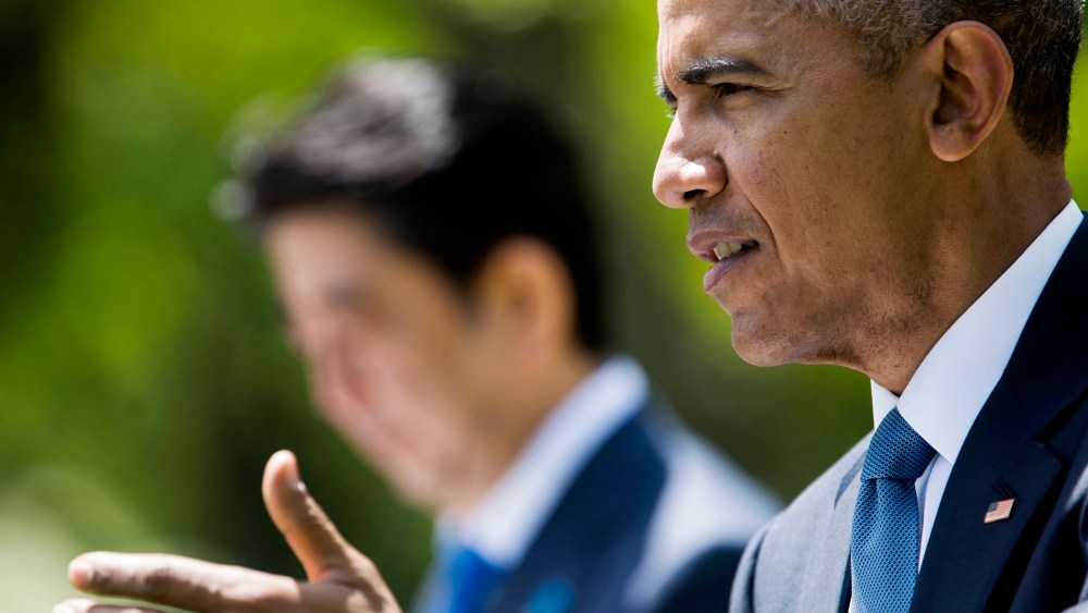 US President Barack Obama (R) speaks at a joint press conference with Shinzo Abe (L), Prime Minister of Japan, in the Rose Garden of the White House in Washington DC on April 28, 2015.