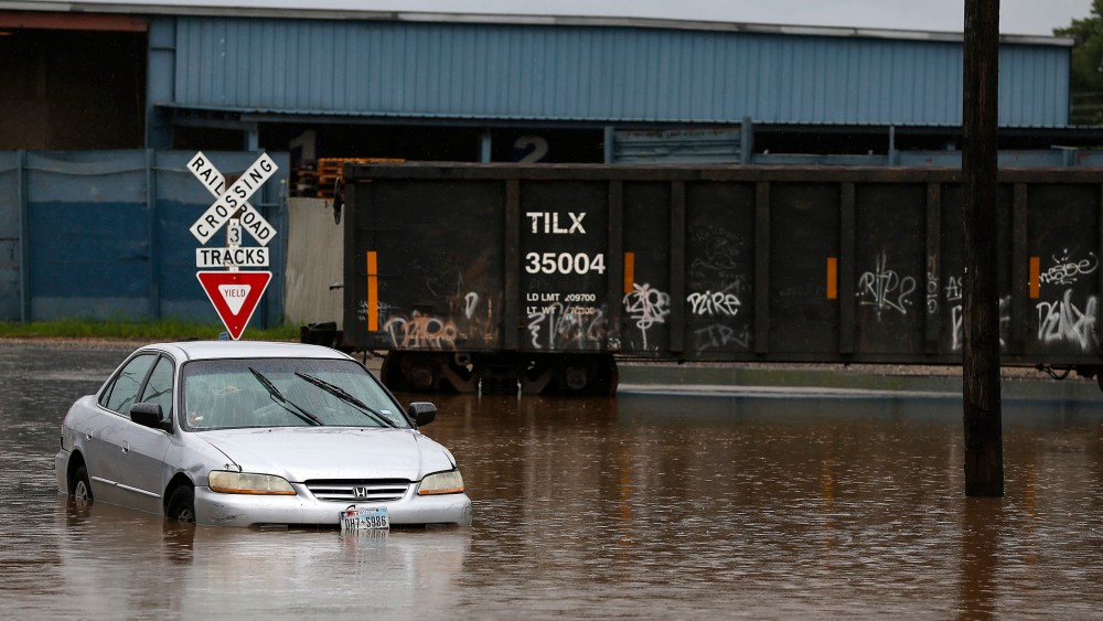 A vehicle is stranded in flood waters on Quitman Street as Tropical Storm Bill moves into the area in Houston, Texas, June 16, 2015. (Photo by Aaron M. Sprecher/EPA)
