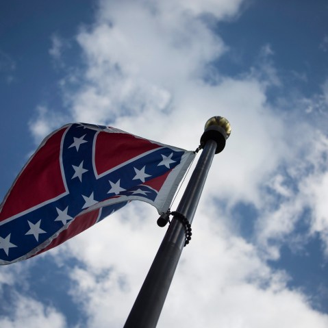 The Confederate flag is seen outside the South Carolina State House Building in Columbia, S.C., on June 23, 2015. (Photo by John Taggart/EPA)