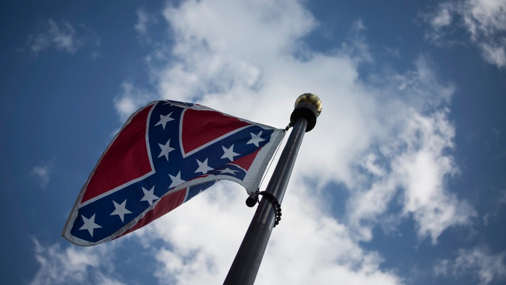 The Confederate flag is seen outside the South Carolina State House Building in Columbia, S.C., on June 23, 2015. (Photo by John Taggart/EPA)