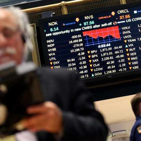 Traders work on the floor of the New York Stock Exchange (NYSE) near the end of the trading day in New York, N.Y., Aug. 21, 2015. (Photo by Andrew Gombert/EPA)