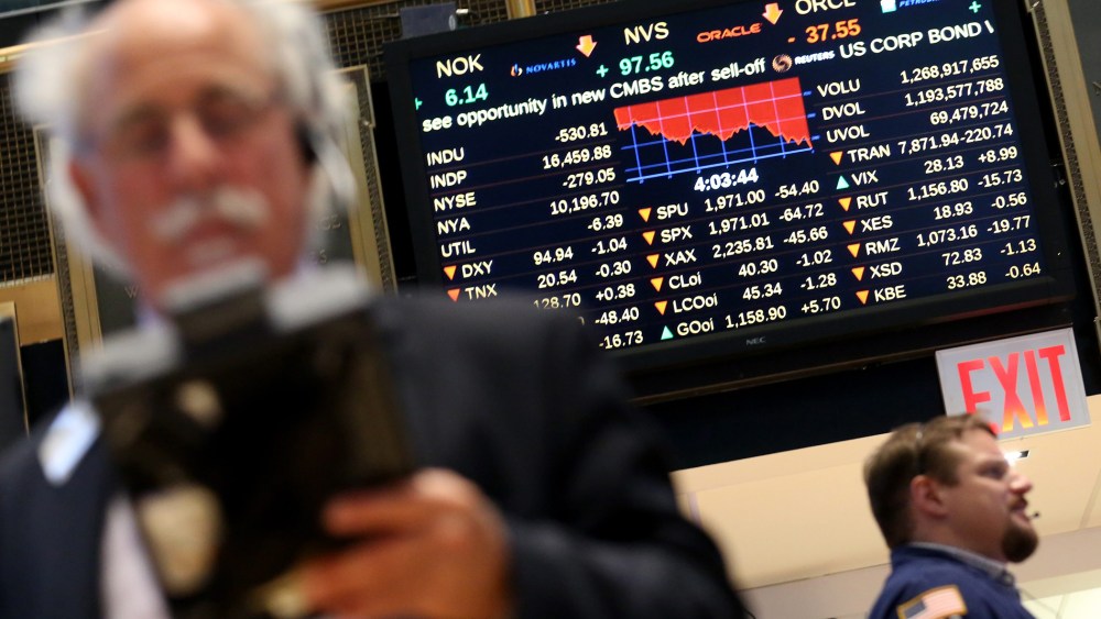 Traders work on the floor of the New York Stock Exchange (NYSE) near the end of the trading day in New York, N.Y., Aug. 21, 2015. (Photo by Andrew Gombert/EPA)