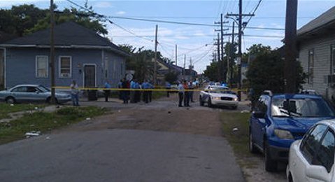 New Orleans Police Department members are seen at the site of a shooting of at least 12 people during a Mother's Day parade in New Orleans, Louisiana, May 12, 2013. (Photo via Fox 8 News)