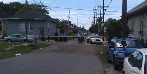 New Orleans Police Department members are seen at the site of a shooting of at least 12 people during a Mother's Day parade in New Orleans, Louisiana, May 12, 2013. (Photo via Fox 8 News)