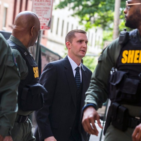 Baltimore police officer Edward Nero (C-R), faced with multiple charges in the death of Freddie Gray, enters the Baltimore court house for his expected verdict in Baltimore, Md., on May 23, 2016. (Photo by Jim Lo Scalzo/EPA)