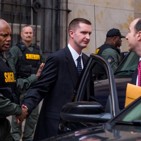 Baltimore police officer Edward Nero, along with his attorney Marc Zayon, leaves the courthouse after being acquitted of all charges in the death of Freddie Gray in Baltimore, Md., May 23, 2016. (Photo by Jim Lo Scalzo/EPA)