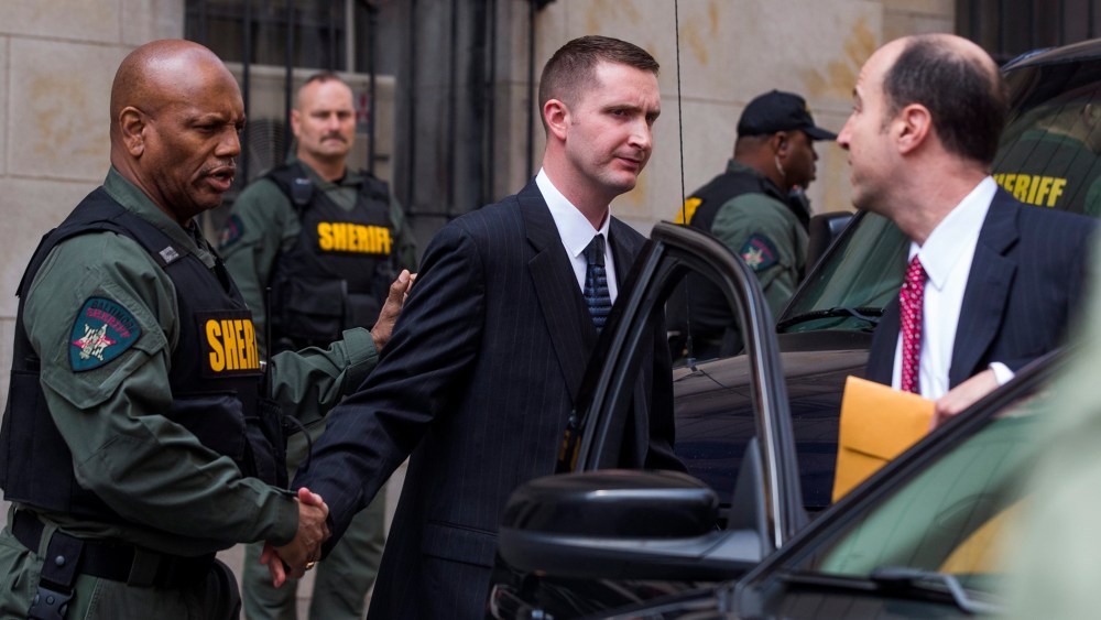 Baltimore police officer Edward Nero, along with his attorney Marc Zayon, leaves the courthouse after being acquitted of all charges in the death of Freddie Gray in Baltimore, Md., May 23, 2016. (Photo by Jim Lo Scalzo/EPA)