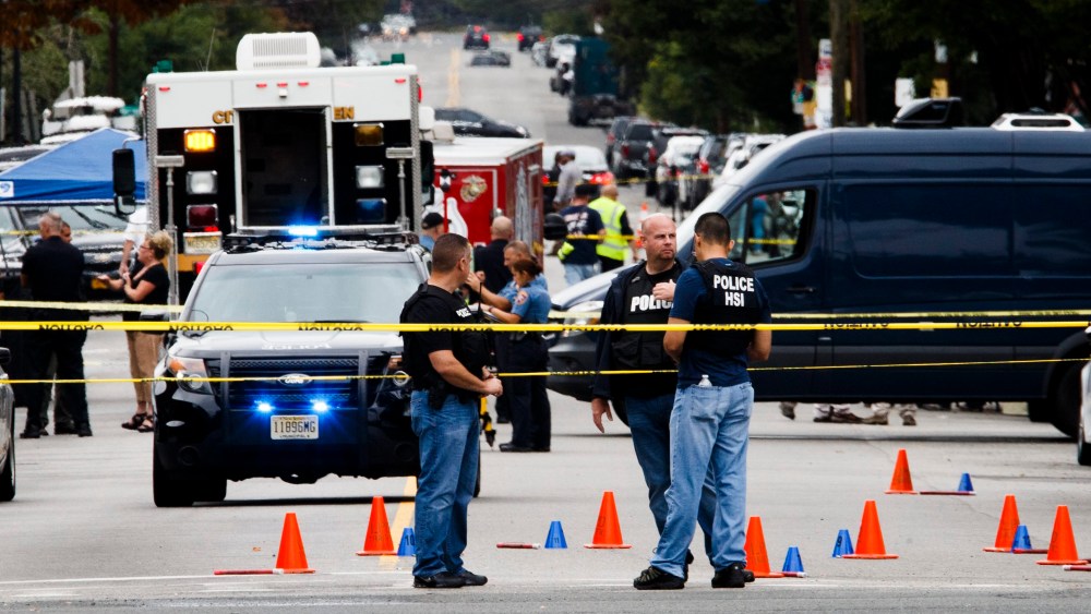Police work at the scene where Ahmad Khan Rahami was arrested following a shootout with police, Sept. 19, 2016, in Linden, N.J. (Photo by Justin Lane/EPA)