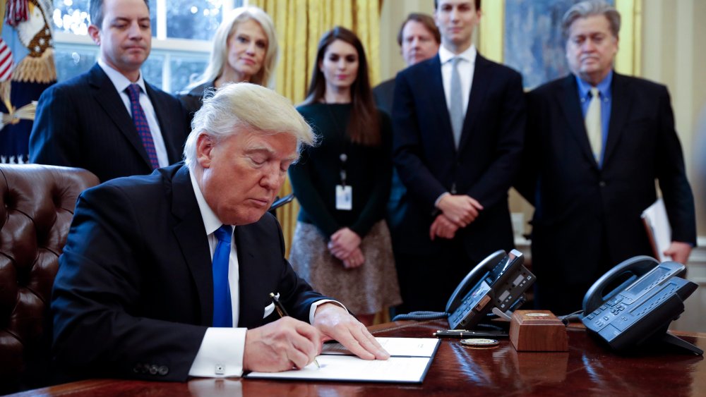Image: US President Trump signs executive order to allow Dakota,. Keystone pipelines