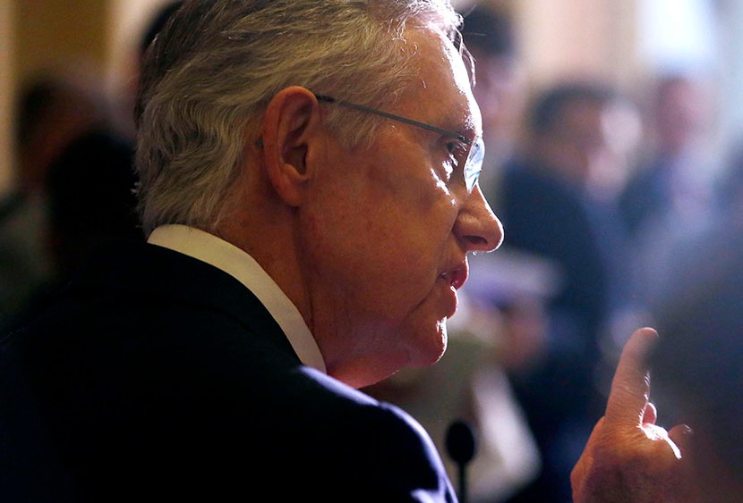 Senate Majority Leader Harry Reid of Nevada speaks to reporters as lawmakers moved toward resolving their feud over filibusters of White House appointees on Capitol Hill in Washington, Tuesday, July 16, 2013. (Photo by Charles Dharapak/AP)