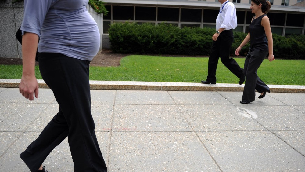 A pregnant woman walks outside the State Department on Aug. 5, 2010 in Washington, DC.