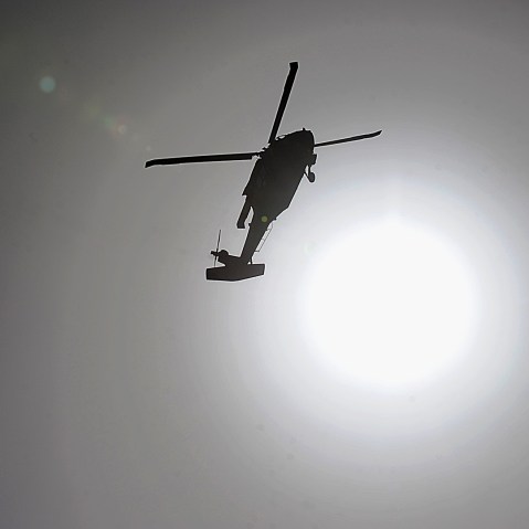 A US military helicopter flies over Kabul. (Photo by Khah Marai/AFP/Getty)