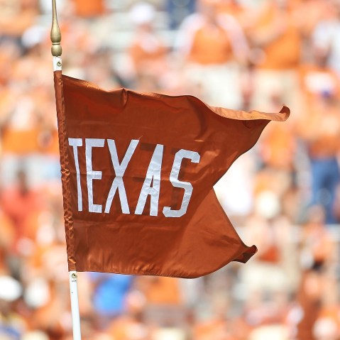 A flag for the Texas Longhorns waves at the Darrell K Royal-Texas Memorial Stadium.