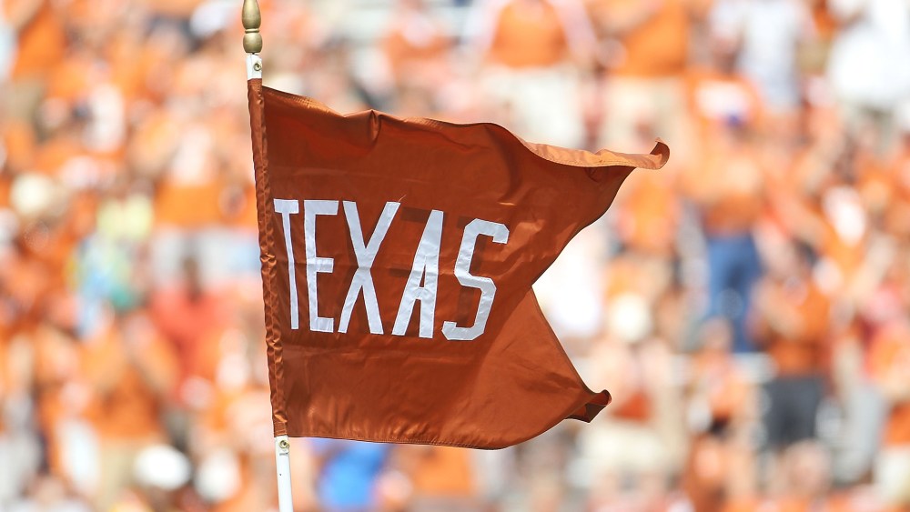 A flag for the Texas Longhorns waves at the Darrell K Royal-Texas Memorial Stadium.