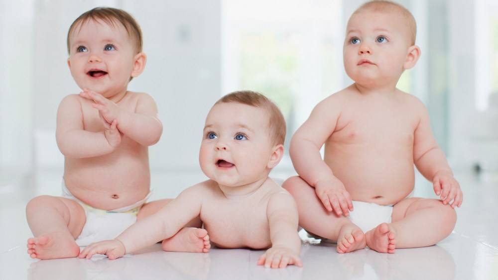 Smiling babies on floor