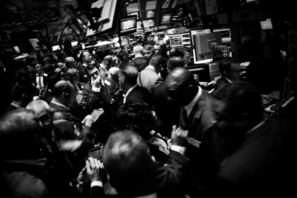Traders work on the floor of the New York Stock Exchange.