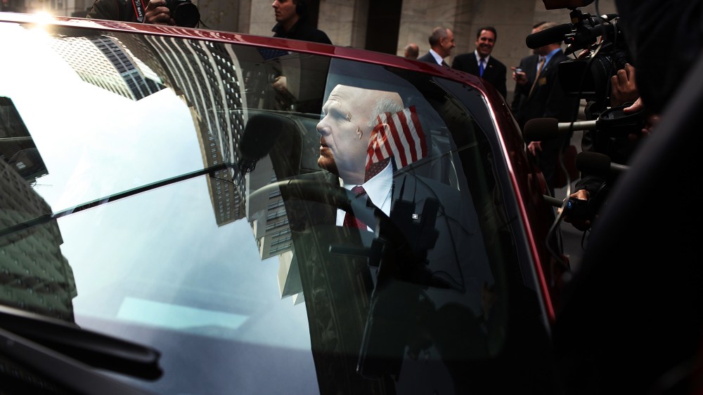General Motors CEO Dan Akerson sits in a GM car in front of the New York Stock Exchange as GM returns to the US stock market on November 18, 2010 in New York, City.