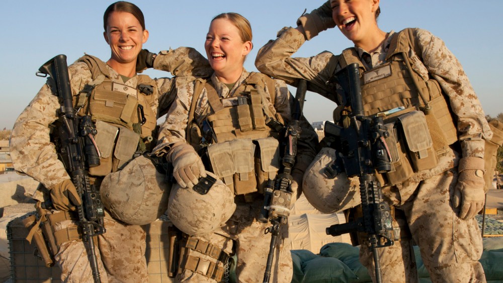 Sargent Sheena Adams and Lance Corporal Kristi Baker and Hospital Corpsman Shannon Crowley working with the FET (Female Engagement Team) 1st Battalion 8th Marines, Regimental Combat team II (Paula Bronstein/Getty Images)