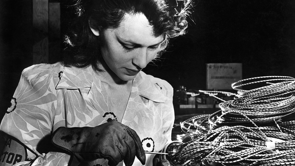 A woman working in an airplane assembly plant in the 1940's.