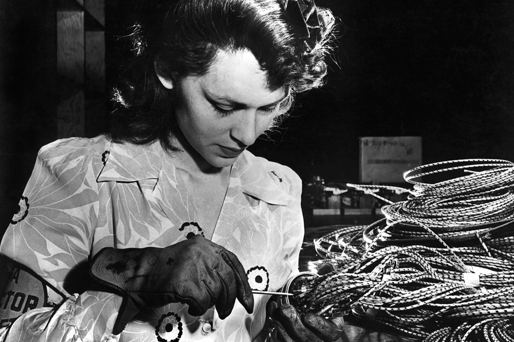 A woman working in an airplane assembly plant in the 1940's.