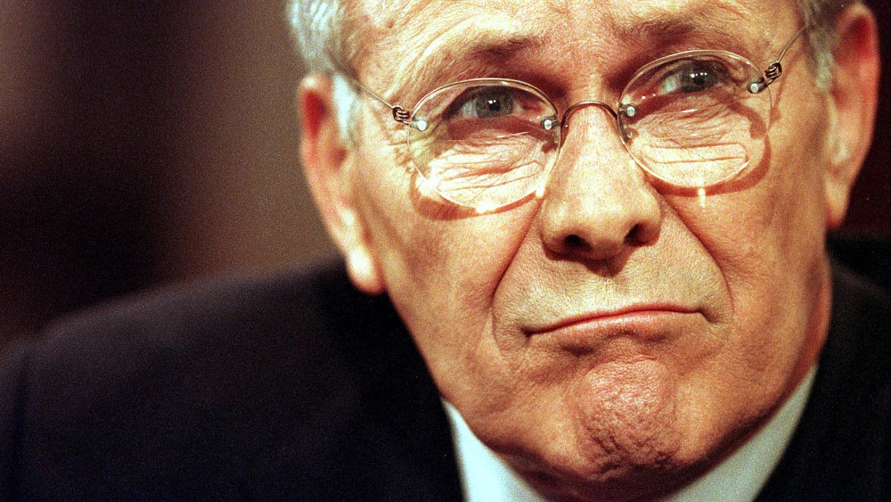 File Photo: Defense Secretary Donald Rumsfeld frowns before his appearance on the CBS talk show "Face the Nation" June 23, 2001 in Washington, D.C. (Photo by Karin Cooper/Getty Images, File)