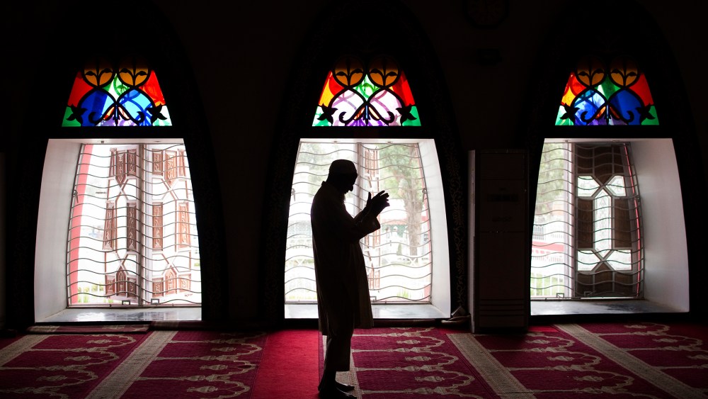 A Pakistani man performs Friday prayers at the Red Mosque in the capital Islamabad on July 8, 2011. (Photo by Behrouz Mehri/AFP/Getty)