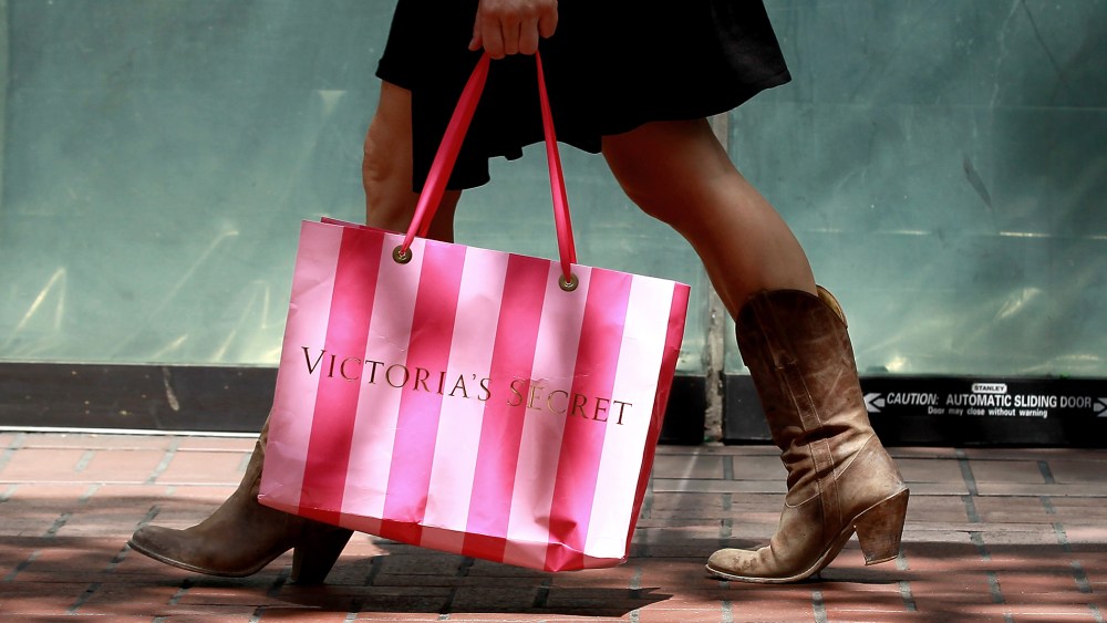 A shopper carries a Victoria's Secret bag as she walks along Market Street on July 29, 2011 in San Francisco, Calif.