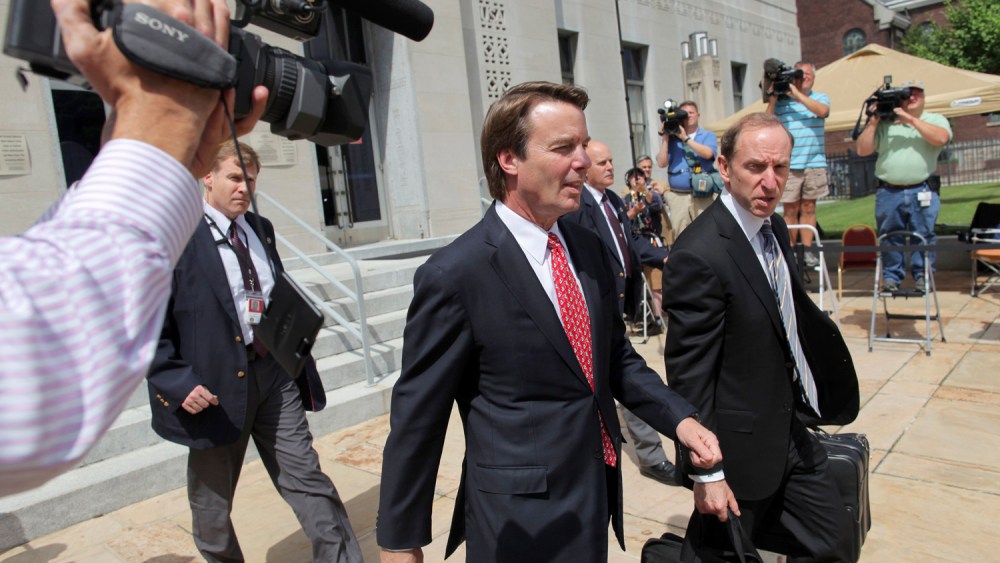 John Edwards exits a federal courthouse next to one of his defense lawyers, Abbe Lowell (R) in Greensboro, North Carolina May 10, 2012. Edwards, 58, is accused of secretly soliciting more than $900,000 in illegal campaign funds from two wealthy donors...