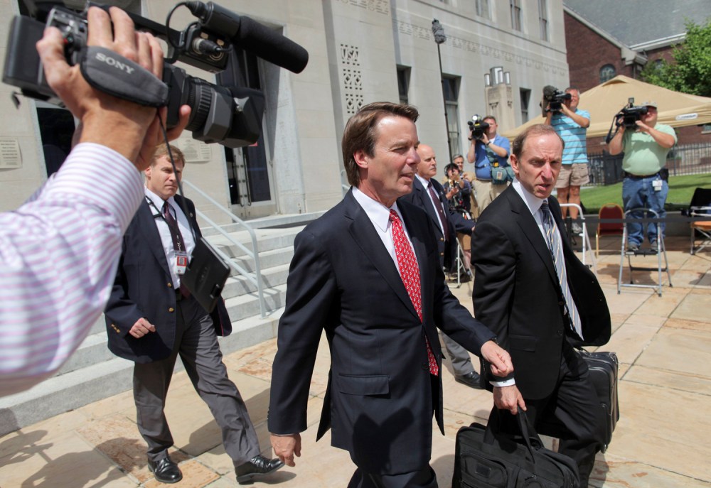 John Edwards exits a federal courthouse next to one of his defense lawyers, Abbe Lowell (R) in Greensboro, North Carolina May 10, 2012. Edwards, 58, is accused of secretly soliciting more than $900,000 in illegal campaign funds from two wealthy donors...
