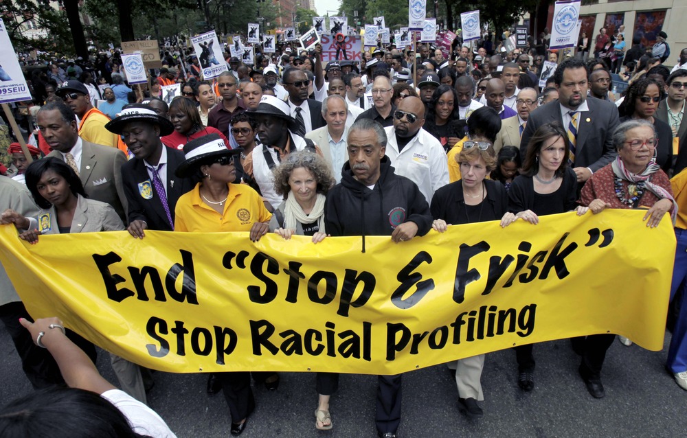 The Rev. Al Sharpton (center) walks with demonstrators during a march to end the "stop-and-frisk" program in New York, Sunday, June 17, 2012. Thousands of protesters from civil rights groups walked down New York City's Fifth Avenue in total silence as...