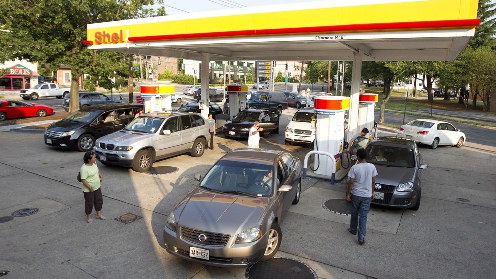 Drivers crowd a gas station in the Tenleytown section of Washington, D.C., June 30, during a massive power outtage resulting from a powerful storm late Friday.