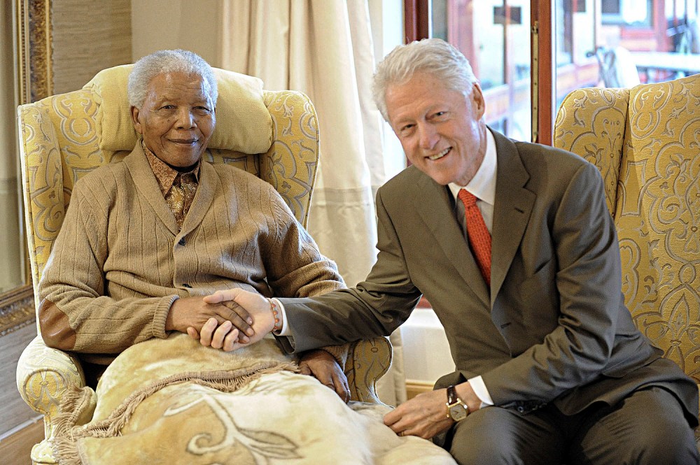 Former U.S. President Bill Clinton visits former South African President Nelson Mandela at his home in Qunu in South Africa's Eastern Cape Province on July 17, 2012.