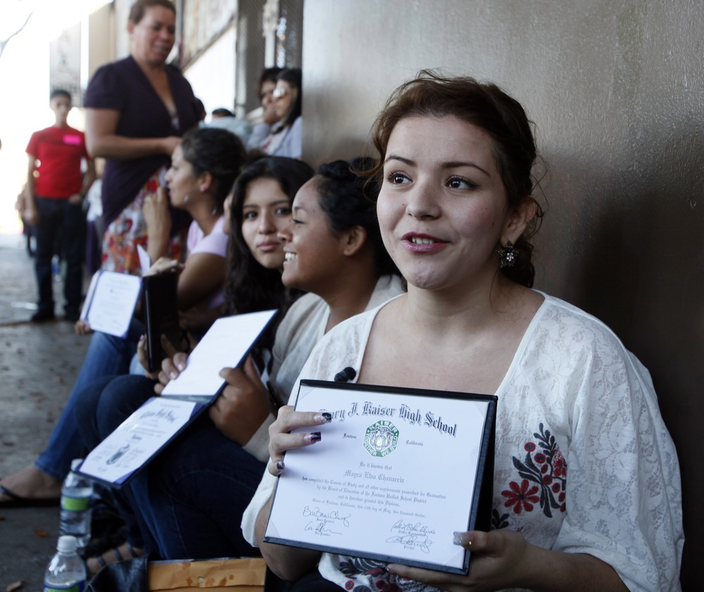 Illegal immigrant Mayra Chavarria holds her high school diploma while waiting outside the Coalition for Humane Immigrant Rights in Los Angeles offices Wednesday, Aug. 15,  2012.  Hundreds of thousands of young illegal immigrants scrambled to get papers...