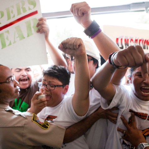 Isela Meraz and Fernando Lopez lead a group of undocumented Hispanics in protest against anti-immigration laws during a briefing on the civil rights effects of state immigration law held by the U.S. Commission on Civil Rights in Birmingham, Ala.