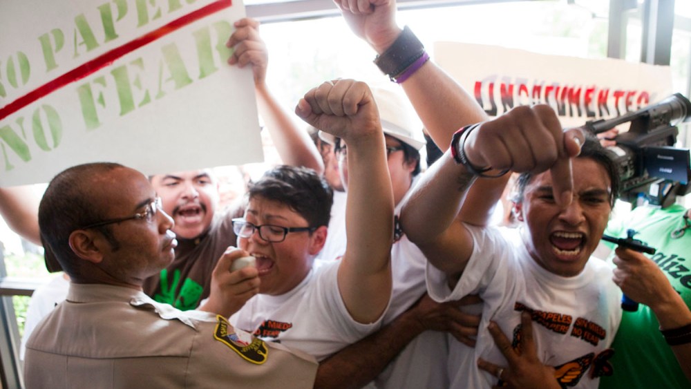 Isela Meraz and Fernando Lopez lead a group of undocumented Hispanics in protest against anti-immigration laws during a briefing on the civil rights effects of state immigration law held by the U.S. Commission on Civil Rights in Birmingham, Ala.
