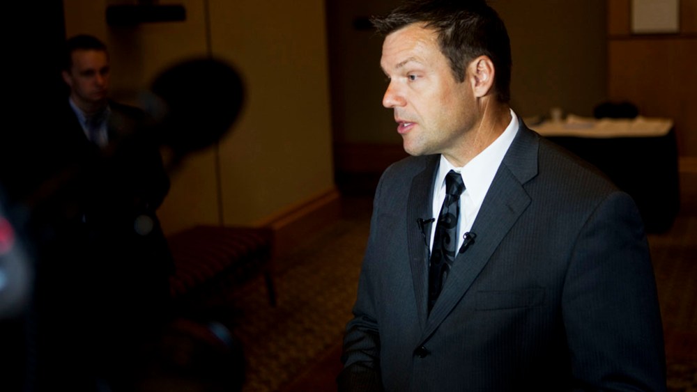 Kris Kobach fields questions from reporters in Birmingham, Ala. on Aug. 17, 2012. (Photo by Bob Miller for NBC News)
