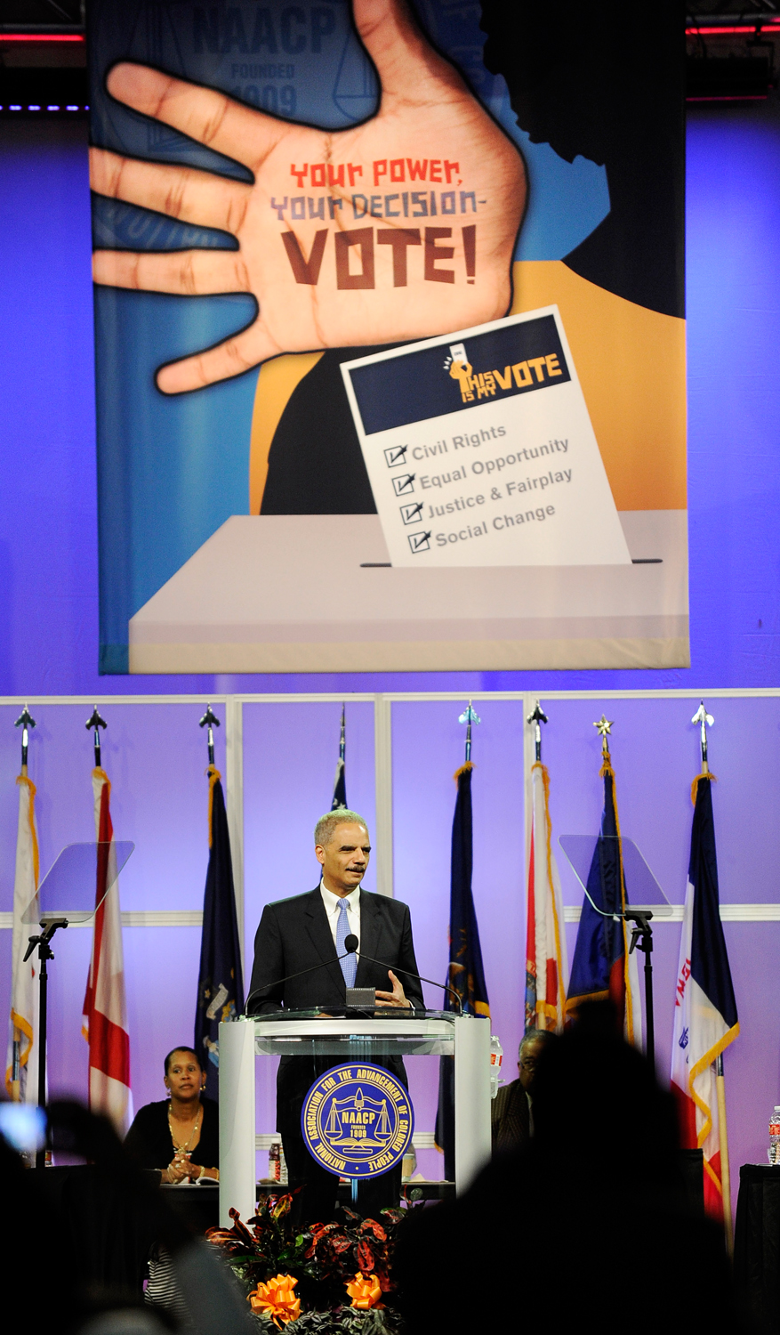 U.S. Attorney General Eric Holder told the NAACP annual convention on July 10 in Houston that he opposes a new photo ID requirement in Texas elections because it would be harmful to minority voters.