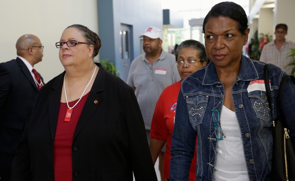 Chicago Teachers Union President Karen Lewis (3rd L) leaves a House of Delegates meeting in Chicago September 16, 2012.