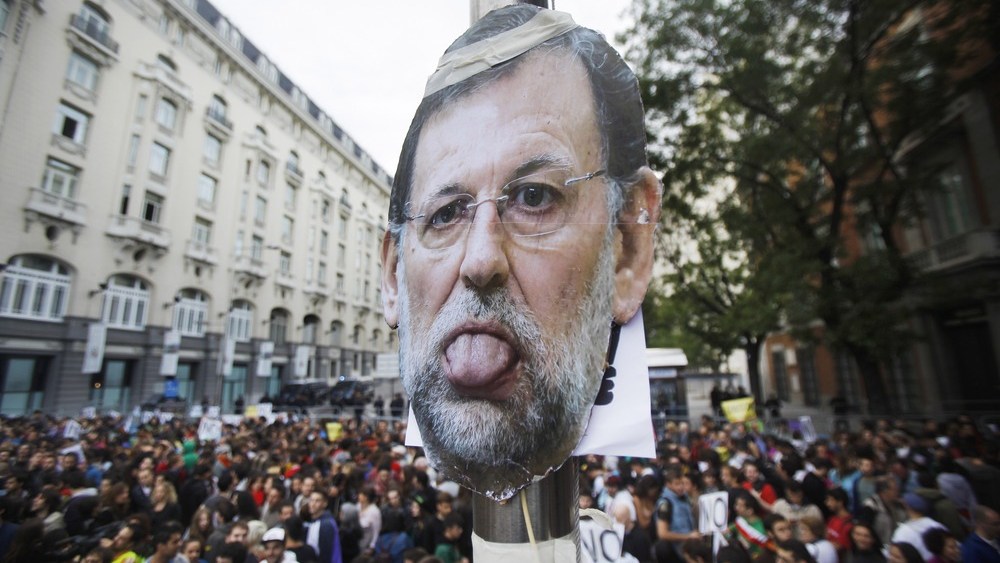 A picture of Spanish Prime Minister Mariano Rajoy is seen during the demonstration in Madrid.