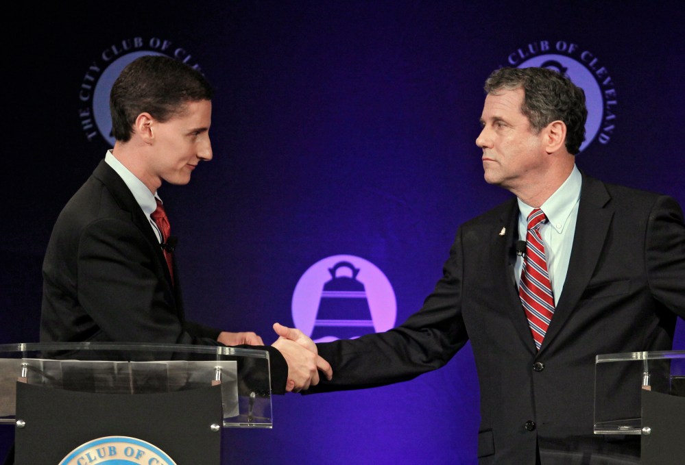 Democratic Ohio Sen. Sherrod Brown, right, shakes hands with Republican challenger and State Treasurer Josh Mandel, after their debate at the City Club in Cleveland on Monday, Oct. 15, 2012. (Photo: AP/Tony Dejak)