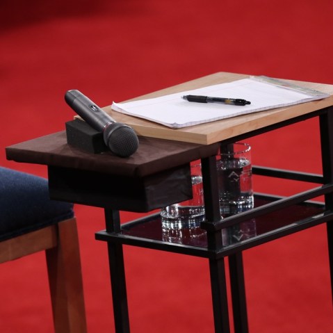 A microphone lies on a table next to a candidate's chair before Republican presidential candidate Mitt Romney and U.S. President Barack Obama answer questions during a town hall style debate at Hofstra University October 16, 2012 in Hempstead, New York.