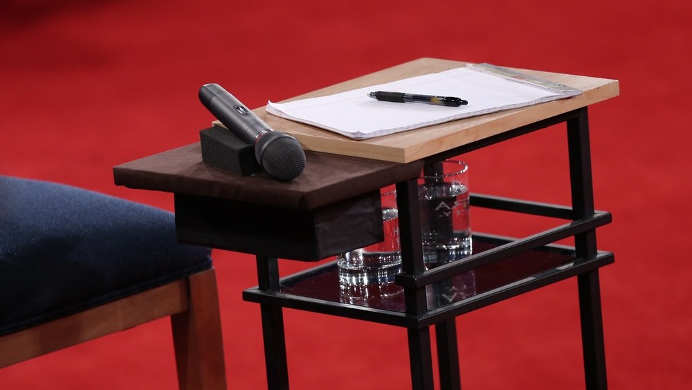 A microphone lies on a table next to a candidate's chair before Republican presidential candidate Mitt Romney and U.S. President Barack Obama answer questions during a town hall style debate at Hofstra University October 16, 2012 in Hempstead, New York.